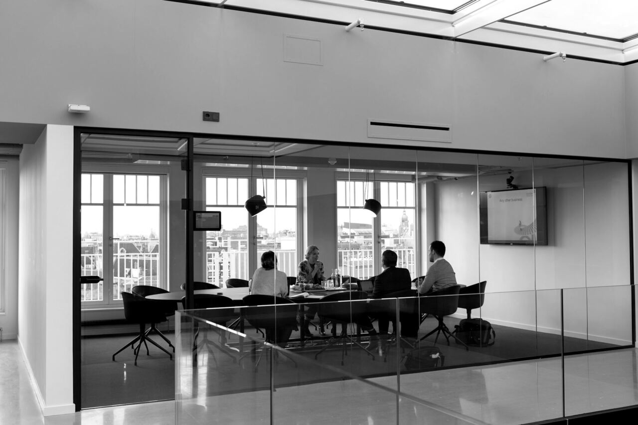 Meeting room in a modern office seen through a glass wall
