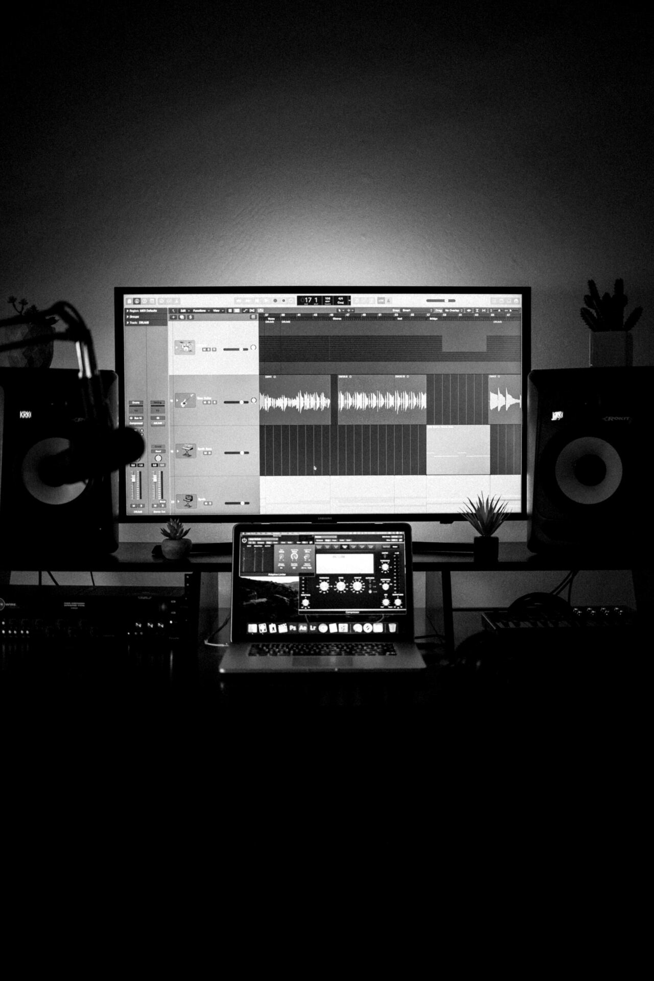 Audio production software open across studio monitors